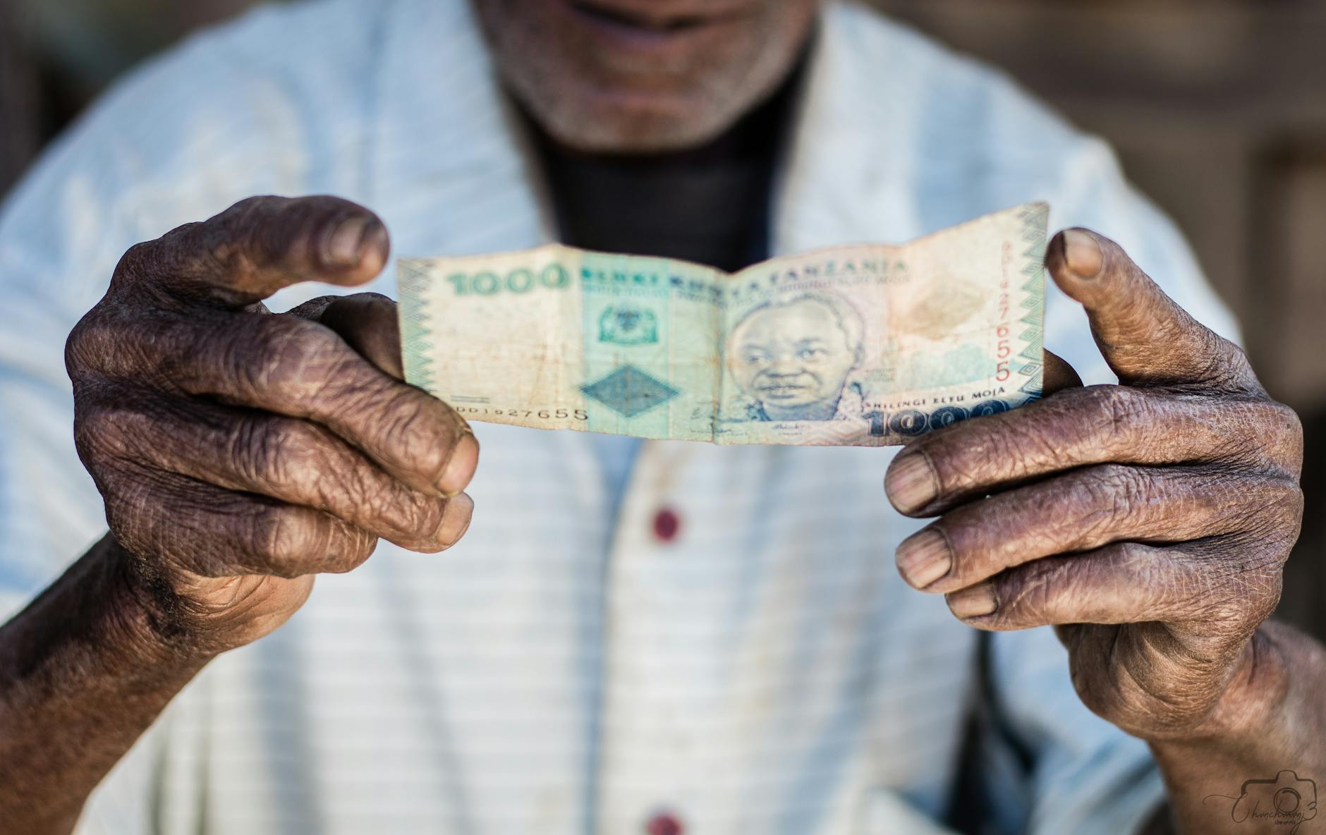 A mobile phone displaying M-Pesa money transfer app