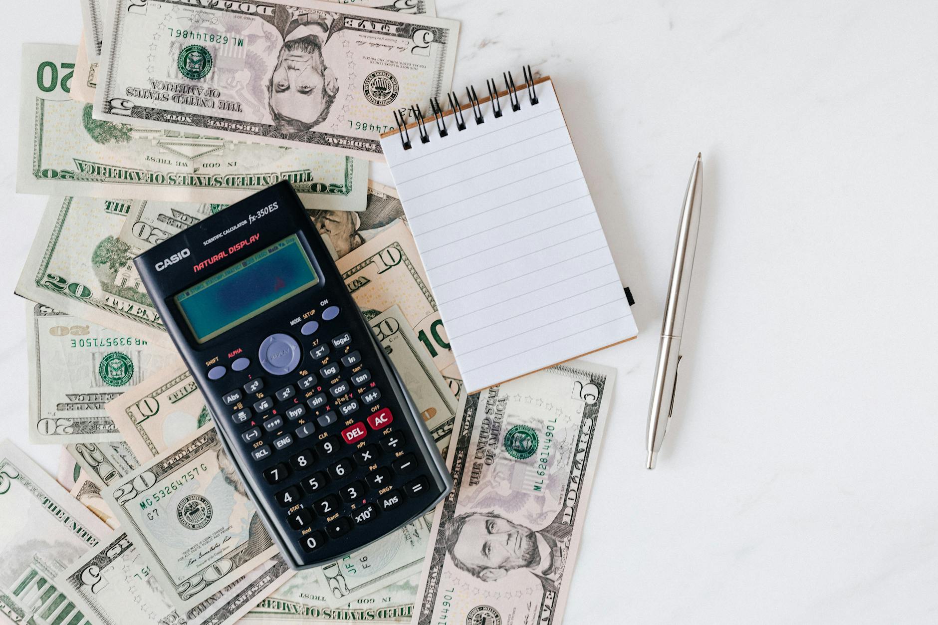 Businessperson reviewing financial statements with multi-currency accounts