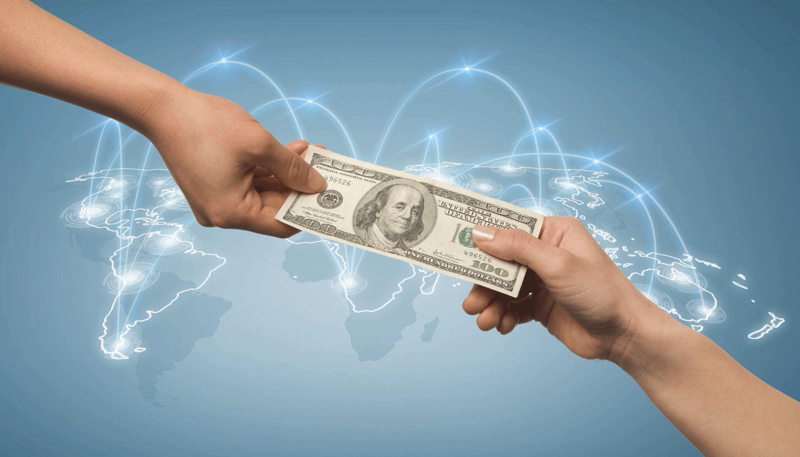 Hands exchanging a US dollar bill over a world map background, symbolising wise money transfers and international currency exchange.