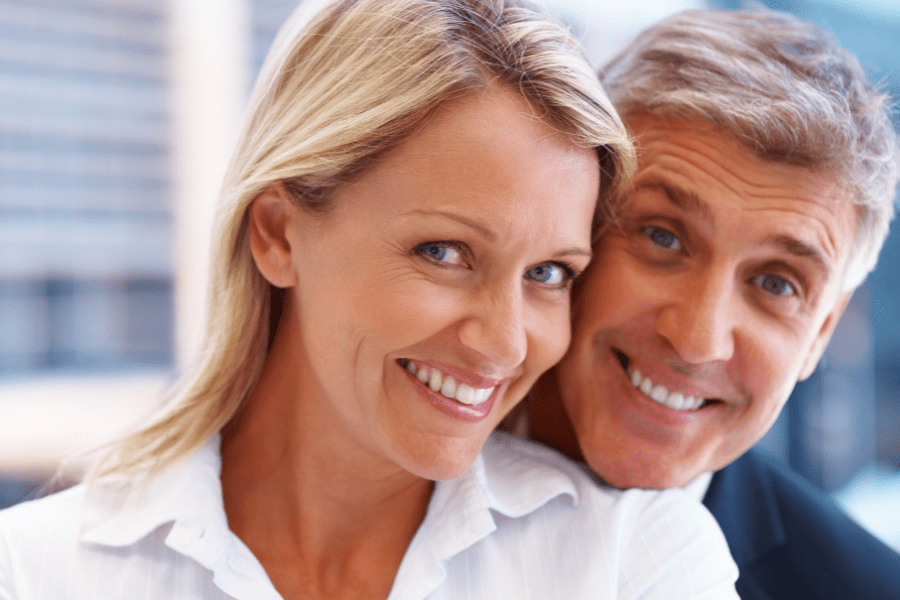 Happy couple that have just completed 1 of the top 5 ways to save on international money transfers
